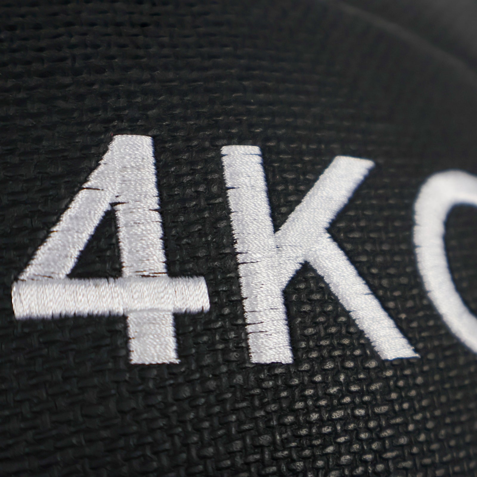 Black wall ball  plate with '4KG' embossed on it