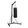 Black punching bag on a stand against a white background