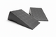 Two black rubber ramps on a white background