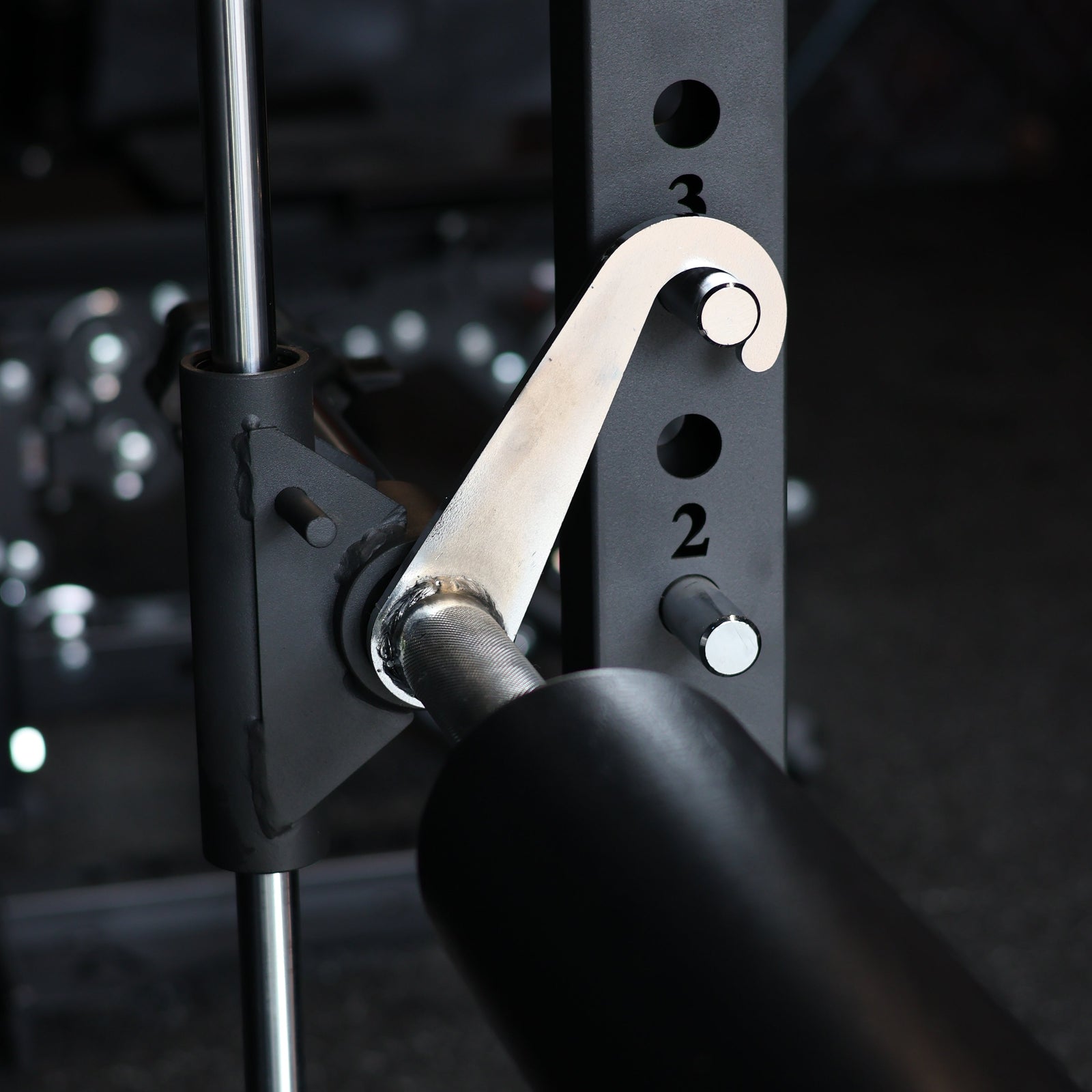 Close-up of a gym barbell with weight plates in a gym setting
