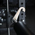 Close-up of a gym barbell with weight plates in a gym setting