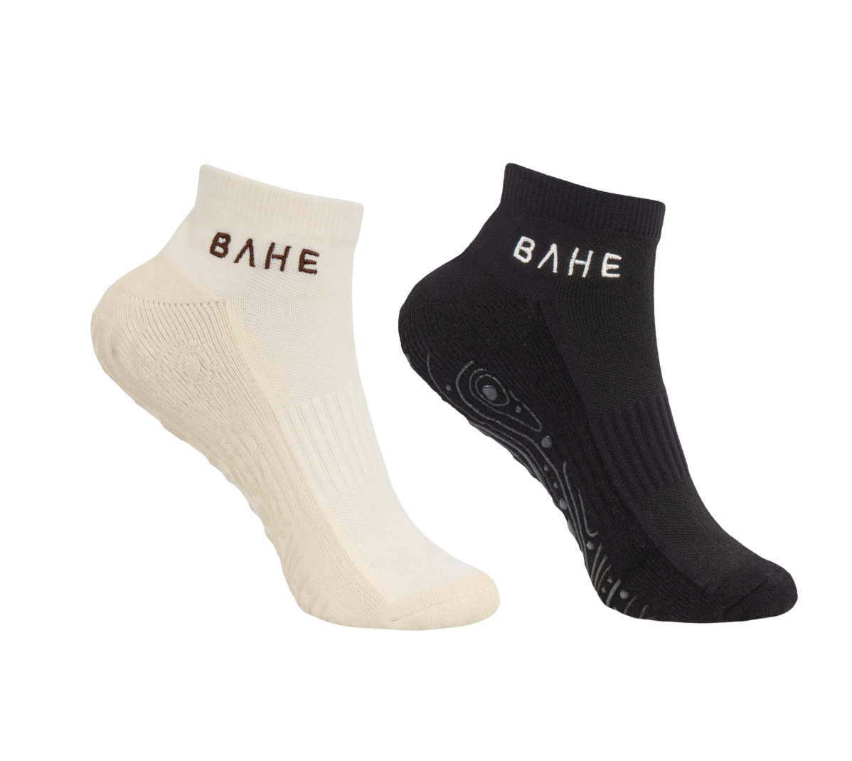 Two low-cut athletic socks shown on a plain white background: one off-white/cream sock with dark lettering and one black sock with white lettering. The brand name 'BAHE' is visible on both socks.